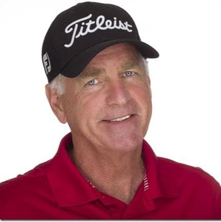 Dr. Peter Mackay working with golf professional